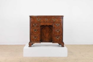 A George II figured walnut kneehole desk,