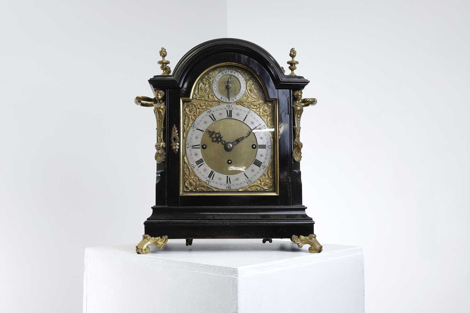 A George III-style ebonised bracket clock,