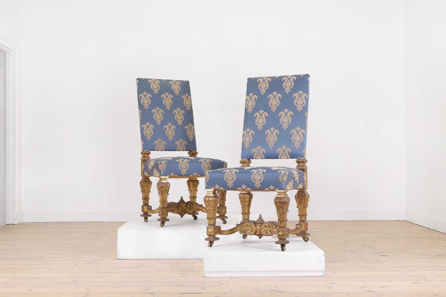 A pair of Louis XIV-style giltwood side chairs,