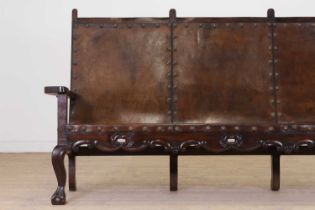 A walnut and leather bench,