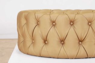 An upholstered pouffe,