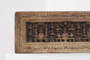 A carved wood manuscript cover,