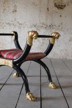 A Regency-style ebonised stool,