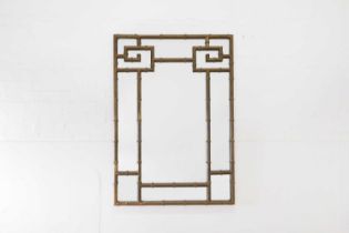 A patinated brass faux bamboo wall mirror,