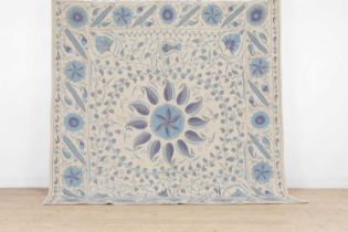 A suzani-inspired flat-weave carpet,