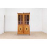 A satinwood cabinet,