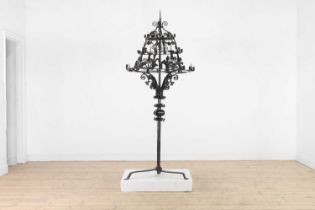 A wrought-iron floor-standing candelabrum,