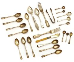 A collection of silver flatware,