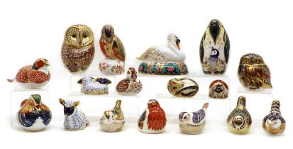 A collection of Royal Crown Derby porcelain paperweights