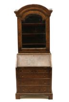 An apprentice walnut bureau bookcase