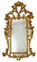 A large modern giltwood overmantle mirror