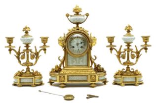 A French gilt metal and porcelain mounted clock garniture