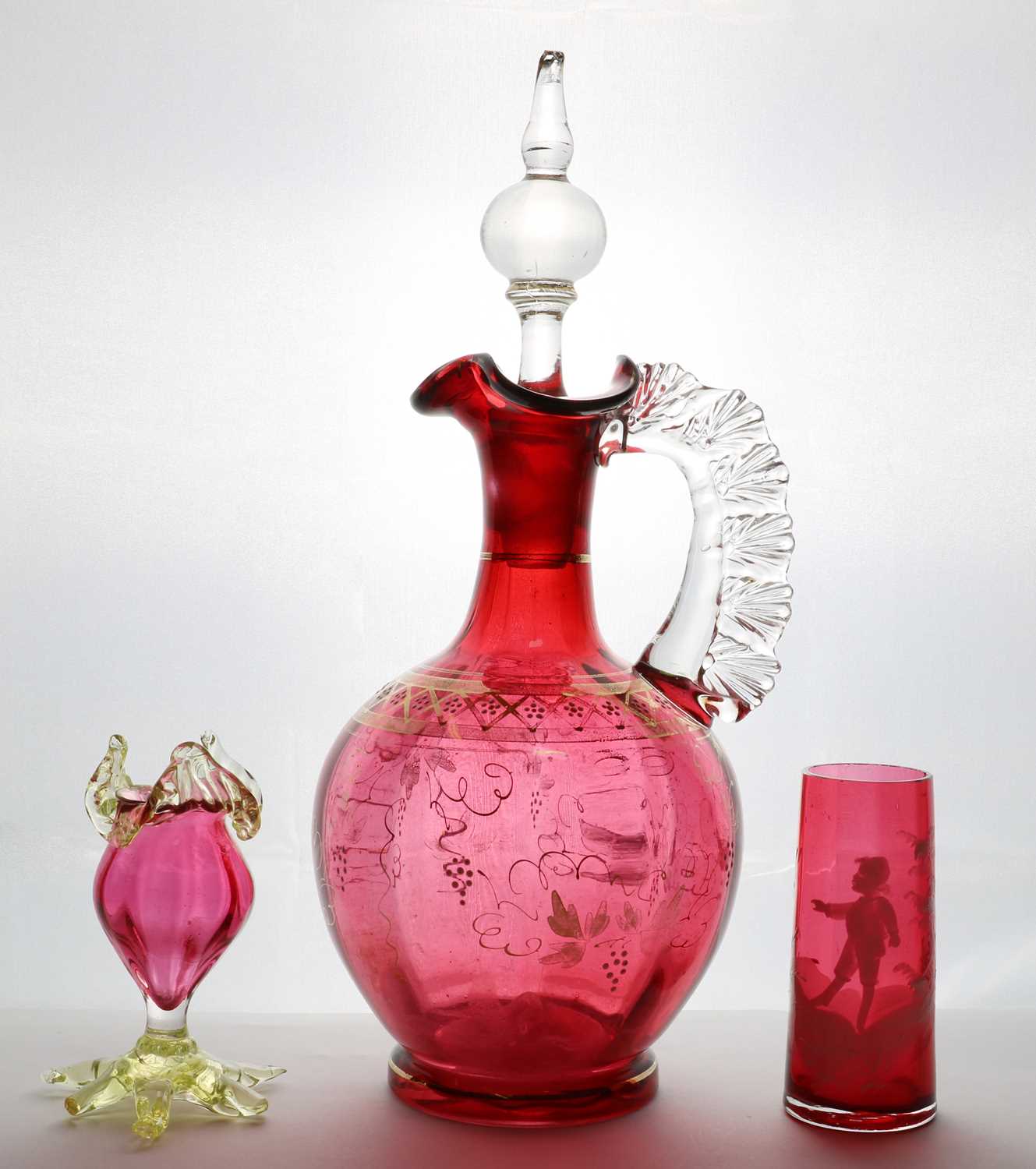 A Victorian cranberry glass decanter and stopper