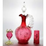 A Victorian cranberry glass decanter and stopper