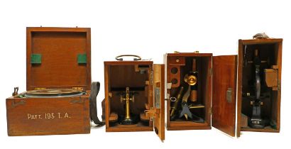 A group of three microscopes