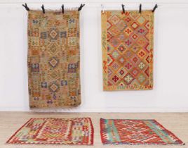 A group of four kilim rugs