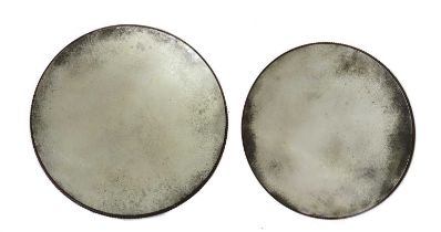 A pair of graduated circular mirrors