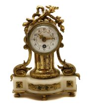 A Louis XVI-style gilt-metal and onyx boudoir clock