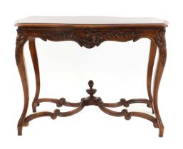 A French Regence style carved walnut centre table,