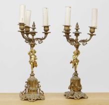 A pair of gilt metal candelabra