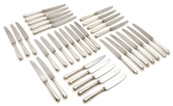 A set of silver handled table knives,