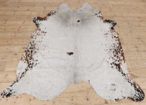 A cowhide rug,