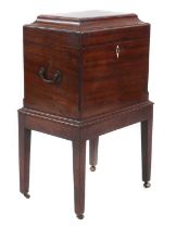 A George III mahogany cellarette and stand