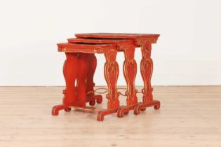 A nest of red-lacquered tables in the Chinese style,