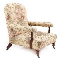 A Victorian walnut open armchair,