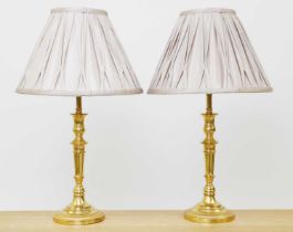 A pair gilt bronze candlestick lamps,