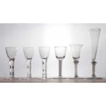 A set of three 18th century style facet cut wine glasses,