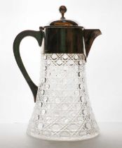 A silver plated and cut glass lemonade jug