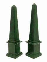 A pair of faux malachite obelisk