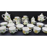 A Villery & Boch 'Geranium' tea and coffee service: 6 breakfast cups and 5 saucers; 6 coffee cups