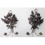 A pair of two-light wall sconces with handmade metal flowers above the candle holders (46 cm high)