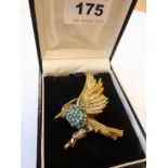 A mid 20th century vintage brooch modelled as an open-winged bird and set with many round