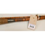 Vintage coarse fishing rod, signed "The Armus heavy caster" two piece cane spinning rod.