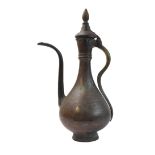 A traditional Arabic Dallah copper-alloy coffee pot, used for centuries to brew and serve Qahwa (