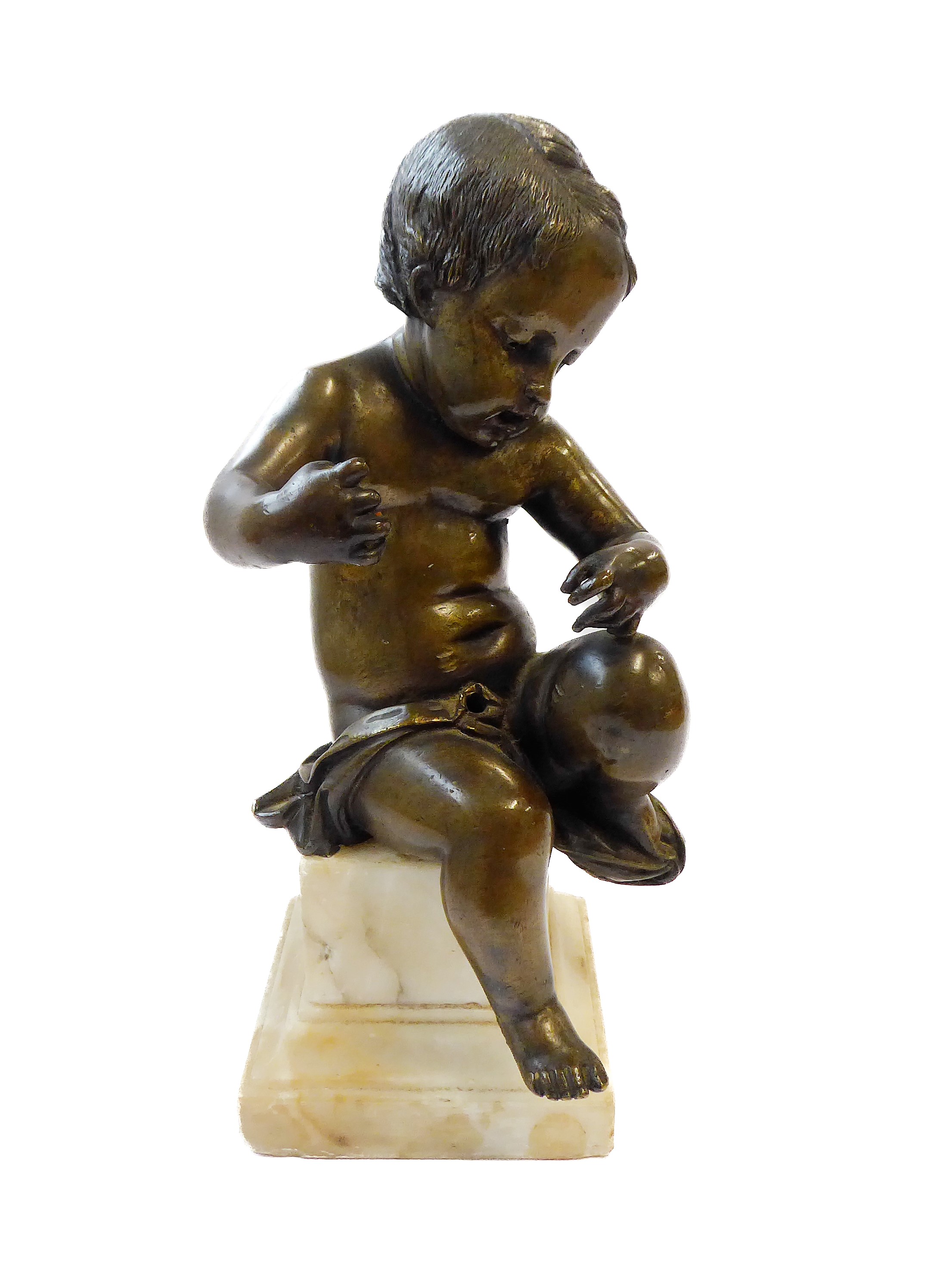 An antique classical bronze sculpture of a seated boy child on a square stepped alabaster base,
