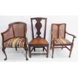 A group of three: an early 20th century mahogany and rattan-caned tub chair on cabriole legs with