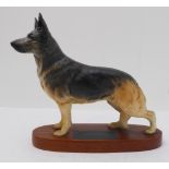 A Beswick porcelain model of a German Shepherd, on stand