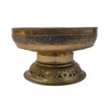 A Chinese brass footed bowl with repoussé banded decoration and pierced foot rim. (A/F) (rim