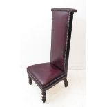 An 19th century-style red-leather upholstered pre-dieu on short turned front legs