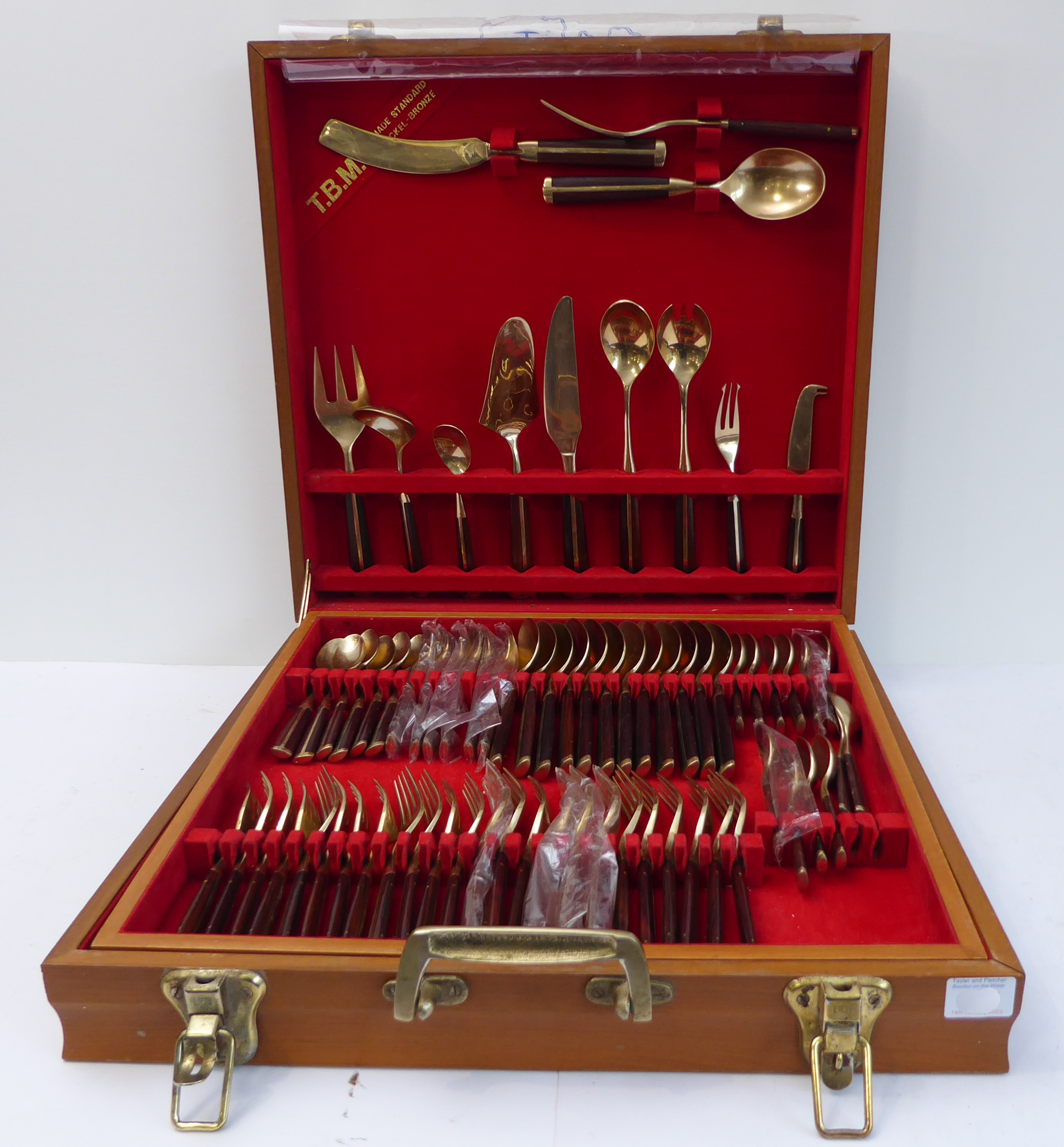 A Thai nickel-bronze ('high tarnish resistant') 12-place cutlery canteen comprising: varying sized