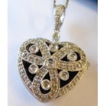 A 9-carat white gold heart-shaped locket set with diamonds on a 9-carat white gold chain