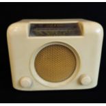 An Art Deco Bush white Bakelite radio, type DAC 90A in good working order.  Condition Report: