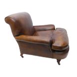 A good 19th century club chair: later brown-leather-upholstery; turned front legs with brass castors