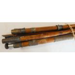 A selection of vintage cane, bamboo and other fishing rods and equipment.