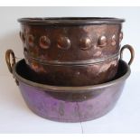 A large 19th century copper jam-pan with riveted loop-handles (15  x 48 cm) and an Arts and Crafts
