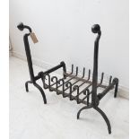 A 20th century blacksmith-made iron dog-grate and firedogs with swan-neck finials (61 cm high) (
